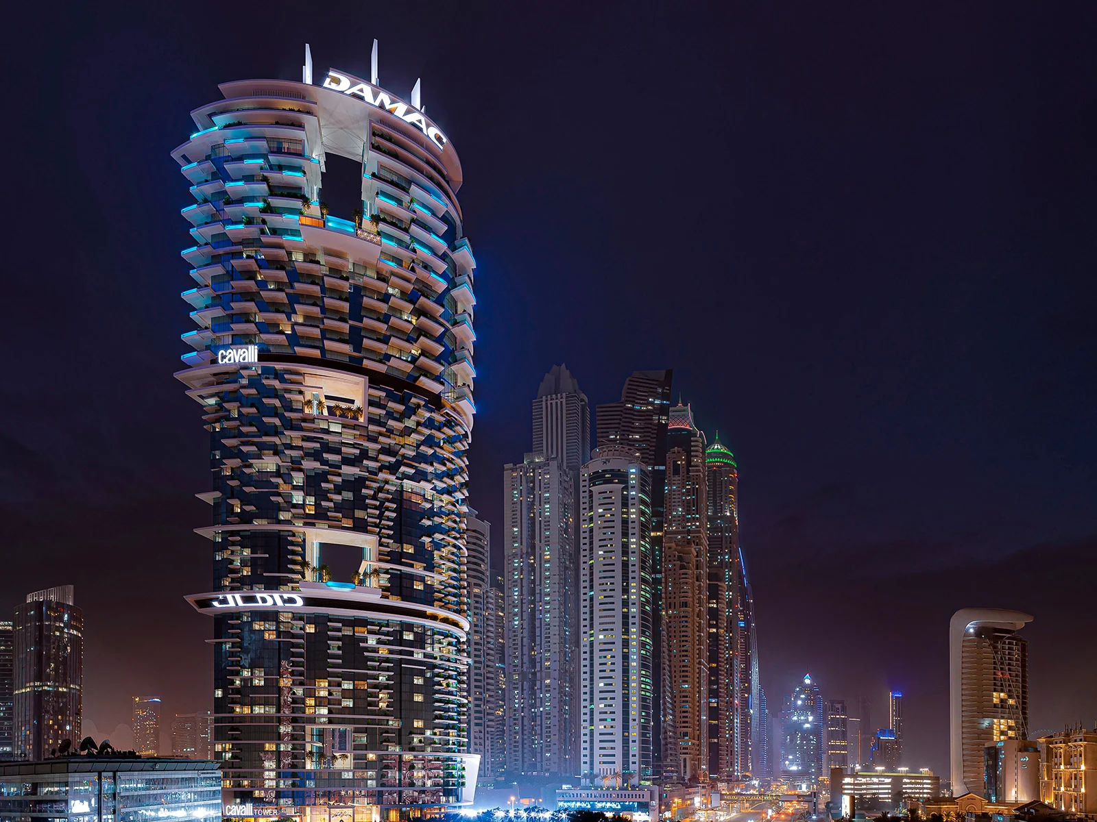 Official nighttime exterior render of Cavalli Tower in Dubai